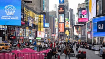 People wearing protective masks are seen in Times Square during the outbreak of Covid-19) in the Manhattan borough of New York City, New York, US, on March 25, 2021. (Photo: Jeenah Moon/Reuters) 