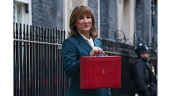 British Chancellor of the Exchequer Rachel Reeves poses with the red budget box outside her office in Downing Street in London, Britain, on November 26, 2025. (Photo: Isabel Infantes/Reuters)