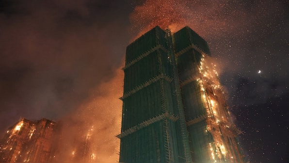 At least 14 killed, dozens trapped after fire engulfs high-rise buildings in Hong Kong