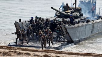Soldiers disembark from an Indian Navy's Mechanised Landing Craft (LCM) as they participate in a tri-services military drill in Porbandar in the western state of Gujarat, India, November 13, 2025. The exercise was part of military drills conducted by the Indian Army, Navy and Air Force under the tri-services framework of Exercise Trishul. File Image/Reuters