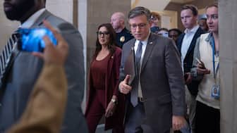 Speaker of the US House Mike Johnson, R-La, centre, joined by US Secretary of Labour Lori Chavez-DeRemer, left, returns to his office after meeting with reporters on day 35 of the government shutdown, at the Capitol in Washington, DC, US, November 4, 2025. File Image/Reuters