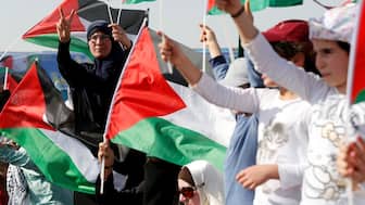 Supporters of Jordanian Muslim Brotherhood and Islamic Action Front party hold Palestinian flags and shout slogans during a rally to mark the 70th anniversary of Nakba in the Jordan Valley, Sweimeh, Jordan, May 11, 2018. File Image/Reuters