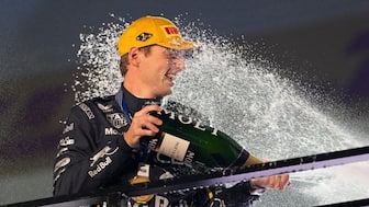 Red Bull Racing's Max Verstappen celebrates on the podium after winning the Las Vegas Grand Prix in Las Vegas, USA. AP