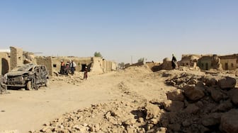 People inspect houses and vehicles destroyed during an airstrike, following a temporary ceasefire, amid the conflict between Afghanistan and Pakistan, in Spin Boldak district of Kandahar Province, Afghanistan, on October 16, 2025. Reuters File/Representational image