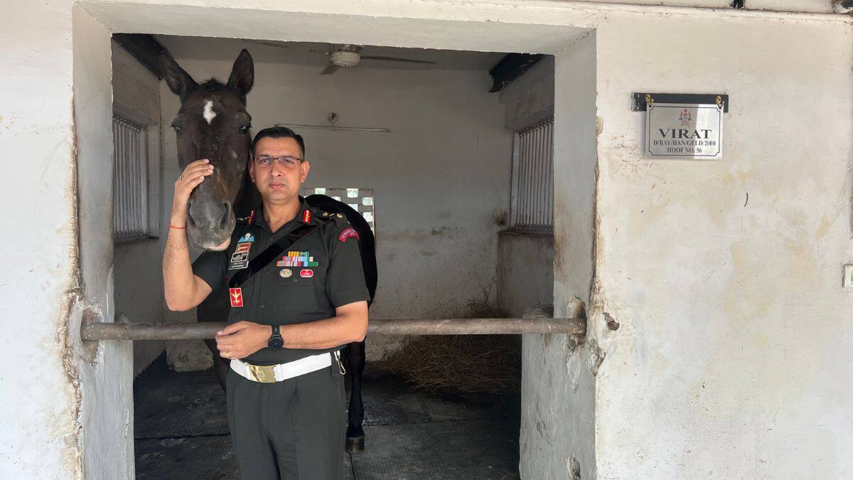 Colonel Amit Berwal, Commandant of the President's Bodyguard poses for a photo with PBG's oldest horse, Virat, at the PBG stables in Rashtrapati Bhavan, New Delhi on October 25, 2025. Firstpost/Anmol Singla