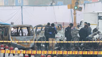 Security personnel work at the site of an explosion near the historic Red Fort in the old quarters of Delhi, India, November 11, 2025. File Image/Reuters