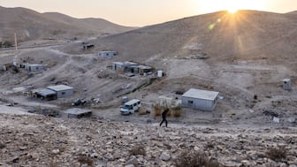Ahmed Kaabna, a Palestinian Bedouin man walks in his small village of Kaabna, near Jericho in the occupied West Bank, on November 6, 2025. (Photo by Menahem Kahana / AFP)
