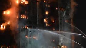 At least 14 killed, dozens trapped after fire engulfs high-rise buildings in Hong Kong