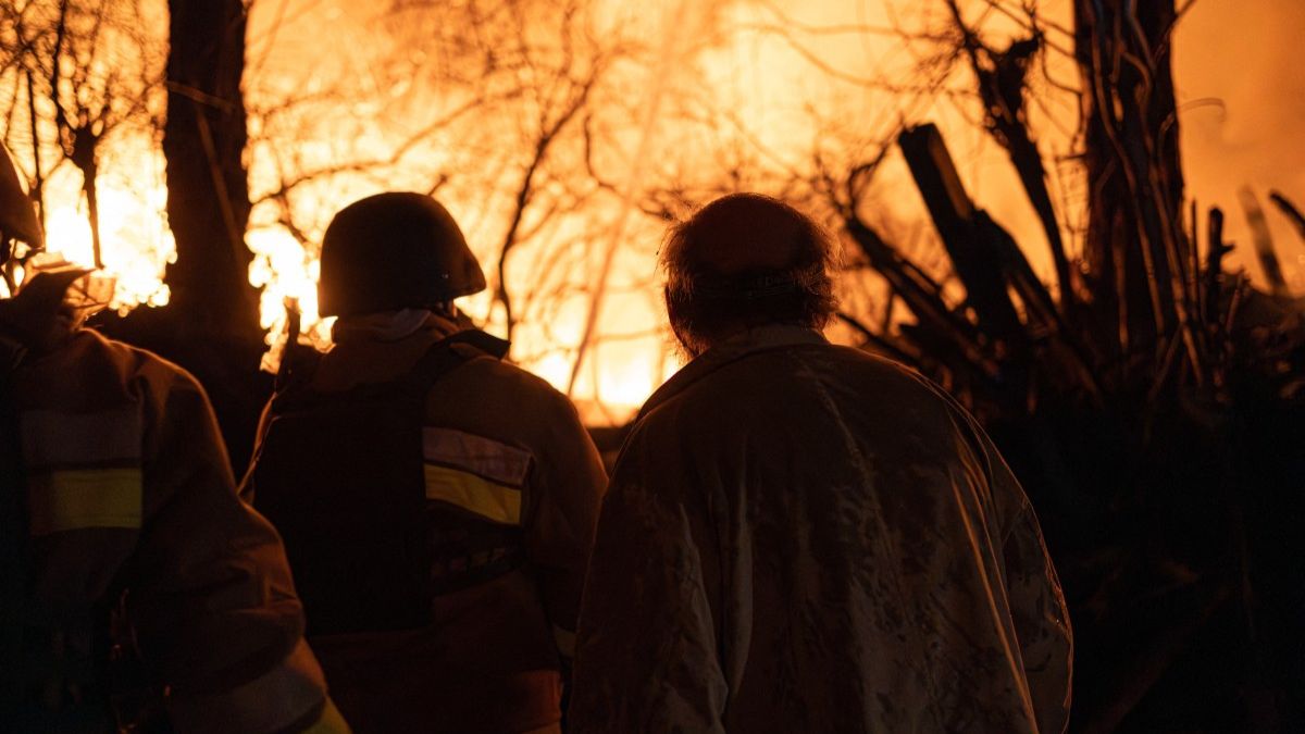 A local resident and firefighters look on at a fire in a damaged private house following a drone attack to Kyiv on November 29, 2025, amid the Russian invasion in Ukraine. Image- AFP A local resident and firefighters look on at a fire in a damaged private house following a drone attack to Kyiv on November 29, 2025, amid the Russian invasion in Ukraine. Image- AFP