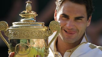 File photo of Roger Federer holding the Wimbledon trophy. AP