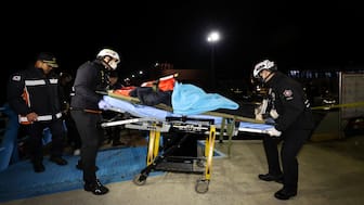 Rescue workers move a passenger rescued from a stranded South Korean ferry carrying about 260 people near a rocky island off Shinan, in Mokpo, South Korea, on Wednesday. Reuters