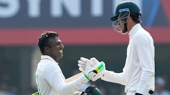 South Africa's Senuran Muthusamy celebrates with Marco Jansen after completing his maiden Test hundred on Day 2 of the second Test against India in Guwahati. AP