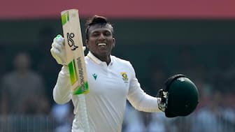 South African all-rounder Senuran Muthusamy celebrates after completing his maiden Test century on Day 2 of the second Test against India in Guwahati. AP