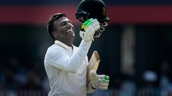 South Africa's Senuran Muthusamy celebrates after scoring a century on the second day of the second cricket test match between India and South Africa in Guwahati, India, Saturday, Nov. 22, 2025. AP