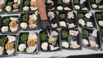 A volunteer prepares meals at the Philabundance Community Kitchen in Philadelphia, October 30, 2025. File Image/AP