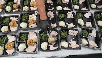 A volunteer prepares meals at the Philabundance Community Kitchen in Philadelphia, October 30, 2025. File Image/AP