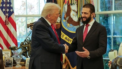In this photo released by Syrian Presidency press office, US President Donald Trump, left, shakes hands with Syria's President Ahmad al-Sharaa, at the White House in Washington, DC, US, November 10, 2025. Image/AP