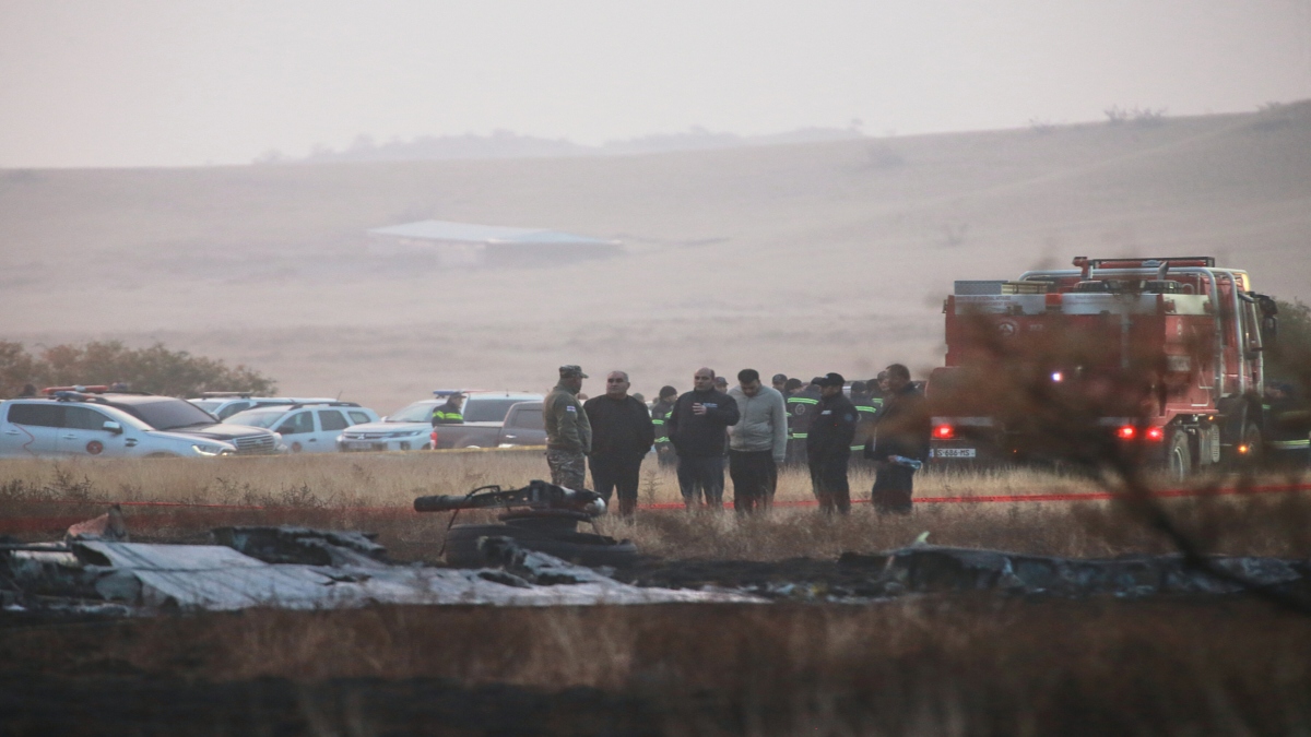 Investigators stand next to debris at a crash site of a Turkish military cargo plane in Georgia's Sighnaghi municipality, close to the Azerbaijani border on Wednesday. AP Investigators stand next to debris at a crash site of a Turkish military cargo plane in Georgia's Sighnaghi municipality, close to the Azerbaijani border on Wednesday. AP