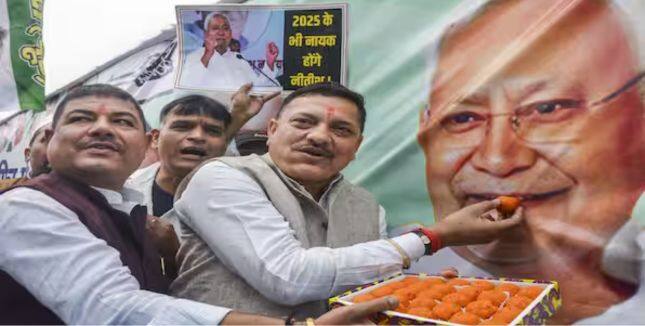 JD(U) party members celebrate as the NDA alliance wins Bihar Assembly elections.