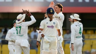 India's Yashasvi Jaiswal walks back to the pavilion after getting dismissed on 13 shortly before stumps on Day 4 as Marco Jansen celebrates with his teammates in the background. AP
