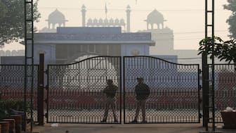 Policemen stand guard at the site of an explosion near the historic Red Fort in the old quarters of Delhi. Reuters