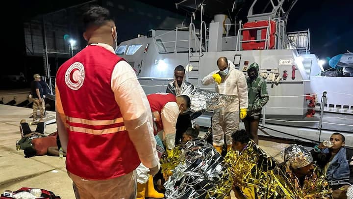 4 dead and dozens missing after boats capsize near Al Khums, Red Crescent says 4 dead and dozens missing after boats capsize near Al Khums, Red Crescent says