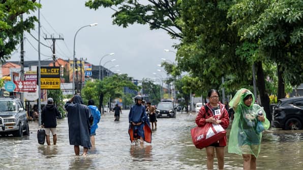Floods and landslides kill at least eight in North Sumatra as torrential rains batter Indonesia