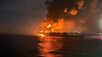 Flames and thick smoke rise from a tanker after blasts hit two Russia-linked vessels in the Black Sea near the Bosphorus, November 28. (Reuters)
