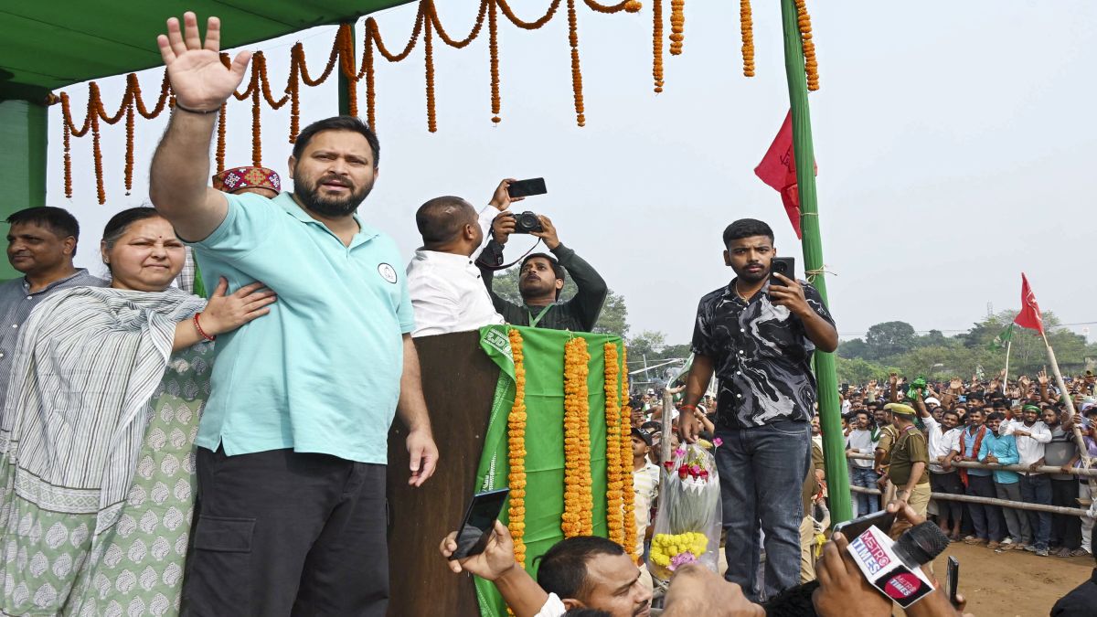 RJD leader Tejashwi Yadav waves to the gathering during a rally ahead of the Assembly elections, at Maner in Patna. He's leading from the Raghopur seat, a bastion of the Yadav family. File image/PTI RJD leader Tejashwi Yadav waves to the gathering during a rally ahead of the Assembly elections, at Maner in Patna. He's leading from the Raghopur seat, a bastion of the Yadav family. File image/PTI