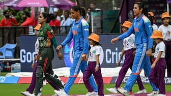Nigar Sultana walks with Harmanpreet Kaur during their ICC Women's World Cup 2025 match. Image: AFP