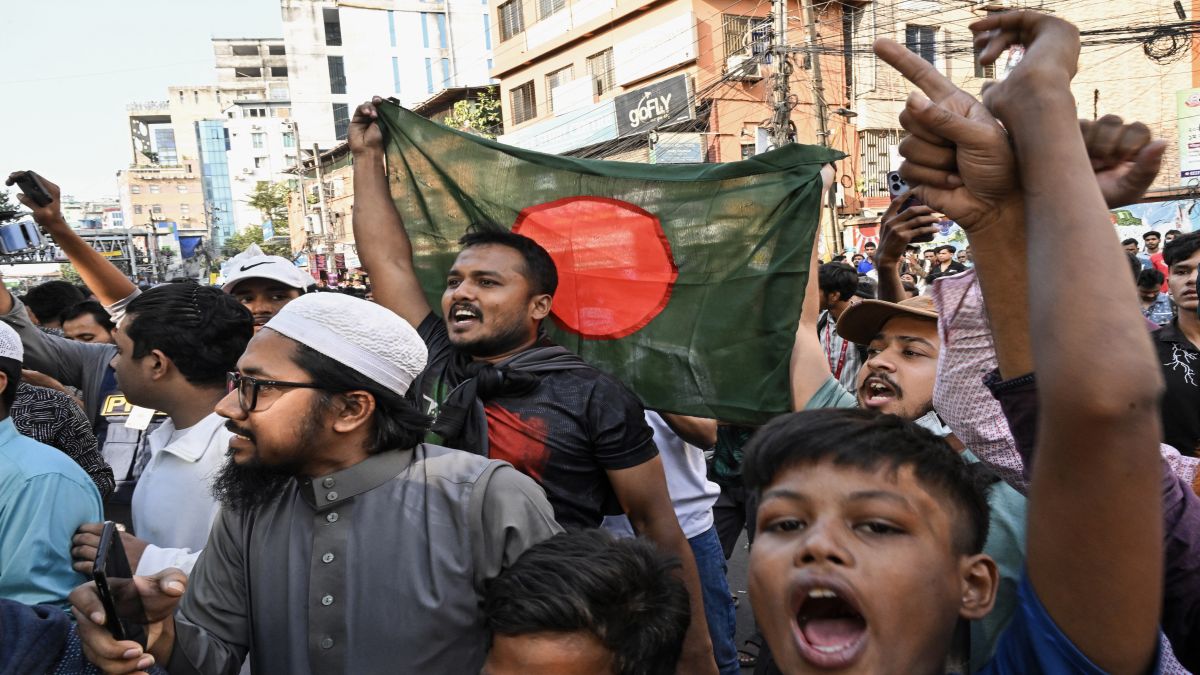 People wave Bangladesh's national flag as they celebrate the court's verdict after former Prime Minister Sheikh Hasina was found guilty and sentenced to death in Dhaka on November 17, 2025. AFP People wave Bangladesh's national flag as they celebrate the court's verdict after former Prime Minister Sheikh Hasina was found guilty and sentenced to death in Dhaka on November 17, 2025. AFP