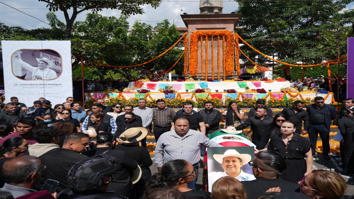 People gather to honour late mayor Carlos Manzo Rodríguez, who was gunned down during Day of the Dead celebrations, in Uruapan, Mexico on 1 Nov 2025. AP People gather to honour late mayor Carlos Manzo Rodríguez, who was gunned down during Day of the Dead celebrations, in Uruapan, Mexico on 1 Nov 2025. AP