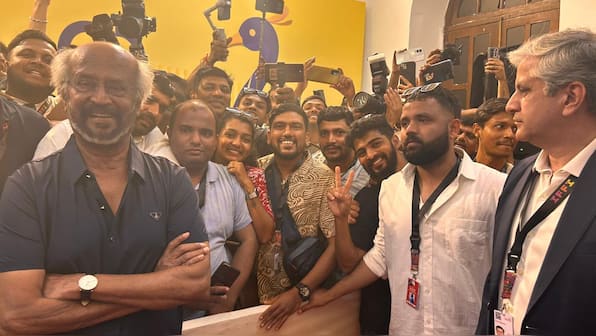 Firstpost At IFFI 2025 | Superstar Rajinikanth poses with the paparazzi at festival's red carpet