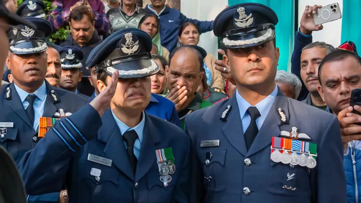 Wing Commander Afshan fighting back tears as she stood in uniform and saluted her husband, Wing Commander Namansh Syal, one final time. The IAF officer lost his life after his Tejas fighter jet crashed during the Dubai air show . PTI Wing Commander Afshan fighting back tears as she stood in uniform and saluted her husband, Wing Commander Namansh Syal, one final time. The IAF officer lost his life after his Tejas fighter jet crashed during the Dubai air show . PTI