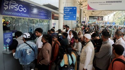 Passengers wait outside the IndiGo airlines ticketing counter at the Chhatrapati Shivaji Maharaj International Airport, after several IndiGo airlines flights were cancelled, in Mumbai, December 6, 2025. Reuters