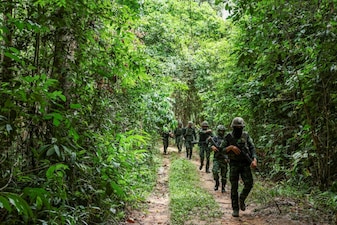 Thai military personnel walk near the forested disputed border between Thailand and Cambodia in the Chong Bok area in Ubon Ratchathani province, Thailand. File image/Reuters