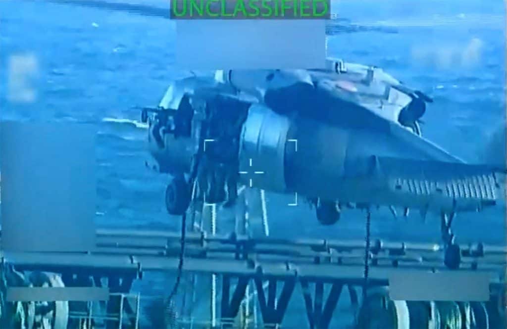 US forces abseil onto an oil tanker during a raid described by US Attorney General Pam Bondi as its seizure by the United States off the coast of Venezuela, December 10, 2025, in a still image from video. Image/X-US Attorney General via Reuters