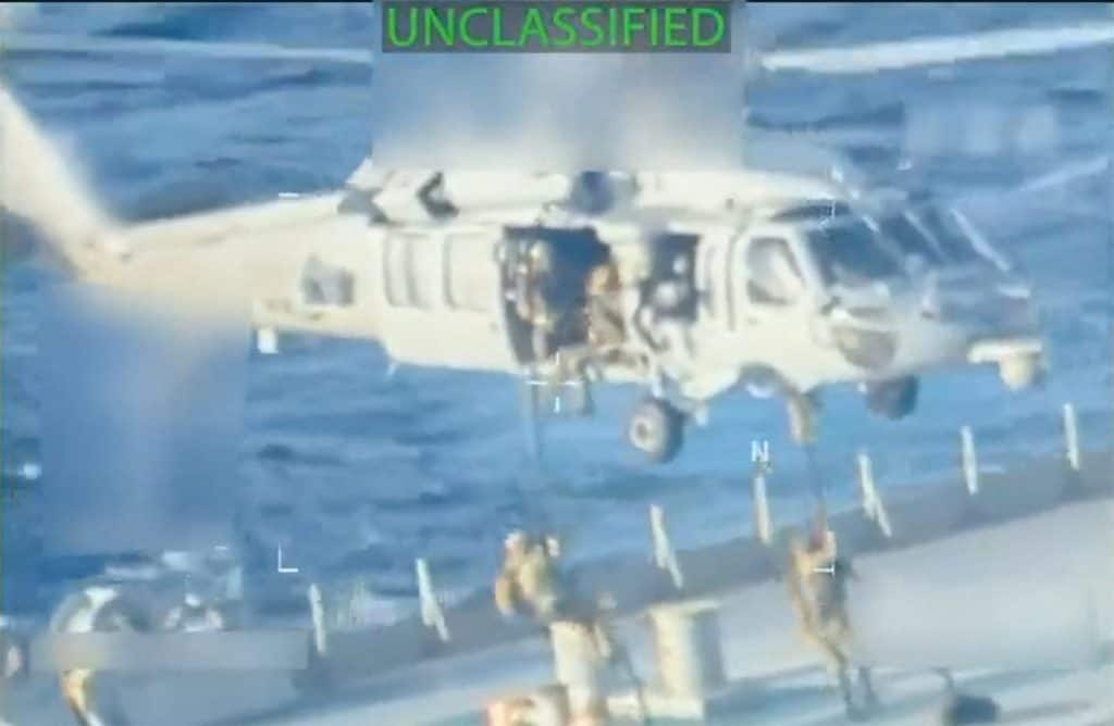 US forces abseil onto an oil tanker during a raid described by US Attorney General Pam Bondi as its seizure by the United States off the coast of Venezuela, December 10, 2025, in a still image from video. Image/X-US Attorney General via Reuters