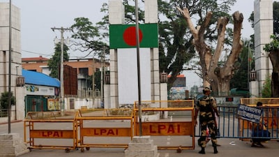 A Border Security Force (BSF) official stands in front of the gates of the India-Bangladesh international border in Petrapole, India, October 16, 2024. Reuters/Sahiba Chawdhary/File Photo