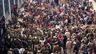 Police officials stop Vishwa Hindu Parishad (VHP) and Bajrang Dal members during a protest near the Bangladesh High Commission over attacks on Hindus in the neighbouring country. PTI