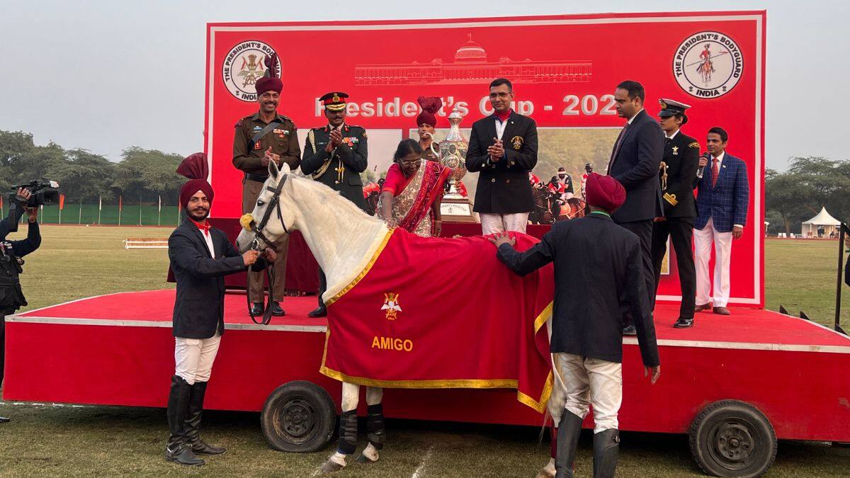President Droupadi Murmu pets Amigo, the PBG horse who has been awarded an honorary caparison after the President’s Polo Cup held at the President’s Bodyguard Parade Ground in New Delhi, November 29, 2025. Amigo is one of the few PBG horses skilled at both polo as well as ceremonial parades seen at Rashtrapati Bhavan. Firstpost/Anmol Singla