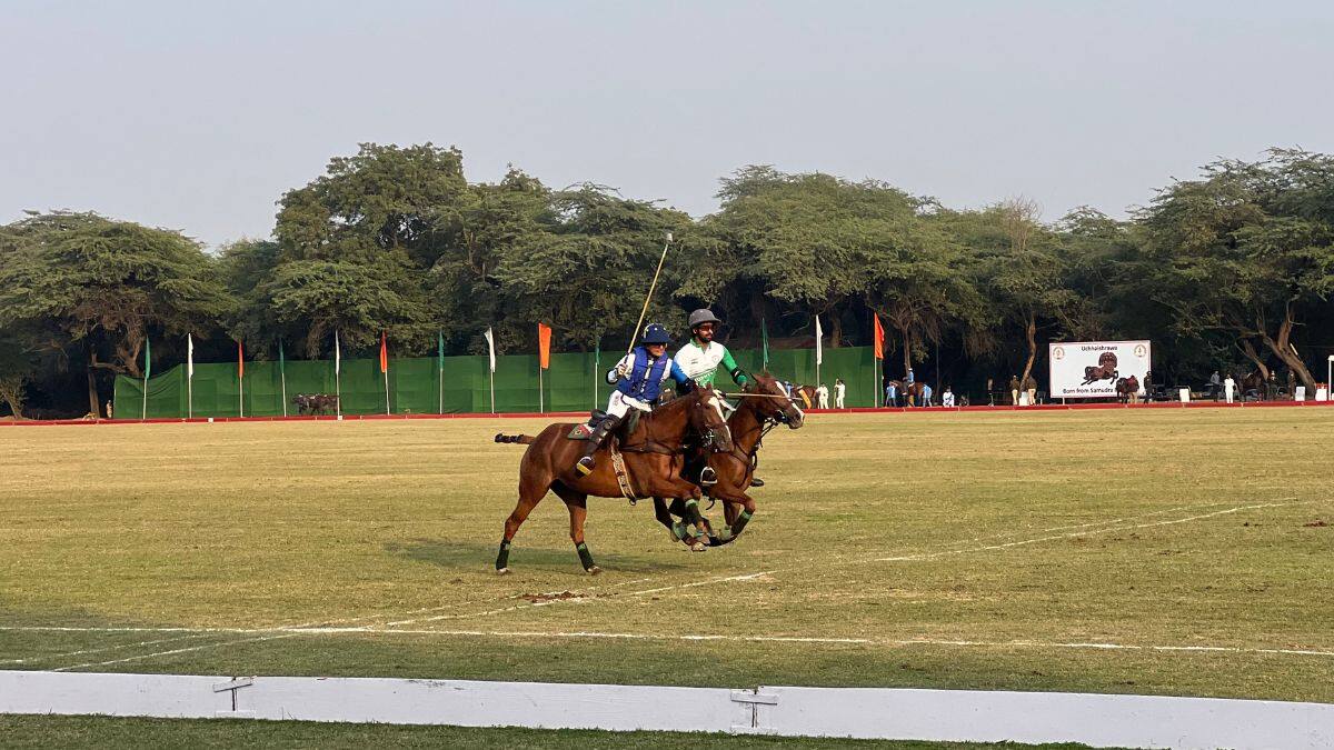 Polo players Naveen Jindal and Siddhant Sharma race towards the ball during the President’s Polo Cup held at the President’s Bodyguard Parade Ground in New Delhi, November 29, 2025. Firstpost/Anmol Singla