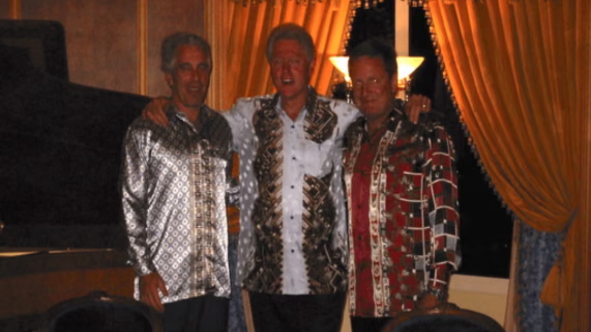 Jeffrey Epstein (left) and Bill Clinton (center) in a photo released by the justice department on Friday. US Department of Justice Jeffrey Epstein (left) and Bill Clinton (center) in a photo released by the justice department on Friday. US Department of Justice