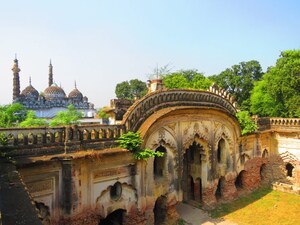 Inside the Khairabad Imambara with the minarets and dome of the Mosque in the background