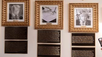 The White House portraits with the new plaques of explanatory text. Biden’s portrait has been replaced with a picture of an autopen. AP