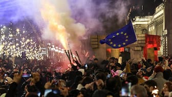 Anti-government demonstrators protest against the Georgian government's postponement of European Union accession talks until 2028, outside the parliament in central Tbilisi on December 31, 2024, the New Year's Eve.  (AFP)