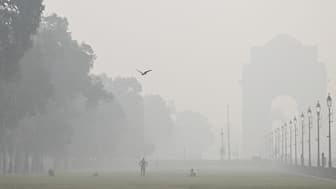People exercise amid smog at India Gate in New Delhi on October 29, 2025. AFP file