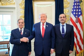 This handout photograph released by Pakistan's Prime Minister Office on September 26, 2025, shows Pakistan's Prime Minister Shehbaz Sharif (L), Army Chief and Field Marshal Syed Asim Munir (R) posing with US President Donald Trump (C) at the White House in Washington, DC. (AFP)