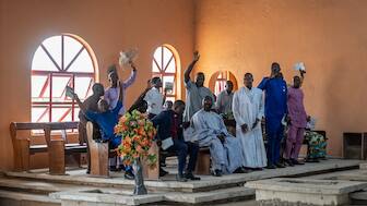 Worshippers pray at the Evangelical Church Winning All (ECWA) during a prayer called by the Christian Association of Nigeria (CAN) in Minna on December 7, 2025.   (AFP)