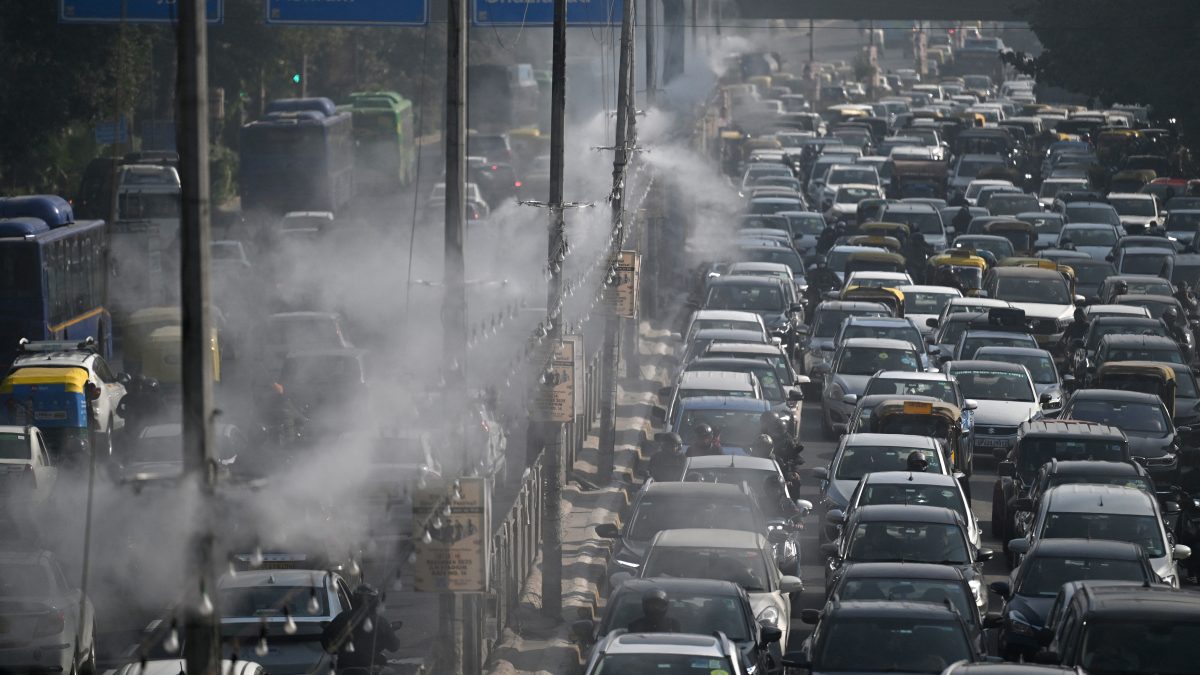 Commuters drive past as anti-smog sprinklers on lamp posts spray water to curb air pollution in New Delhi (AFP) Commuters drive past as anti-smog sprinklers on lamp posts spray water to curb air pollution in New Delhi (AFP)